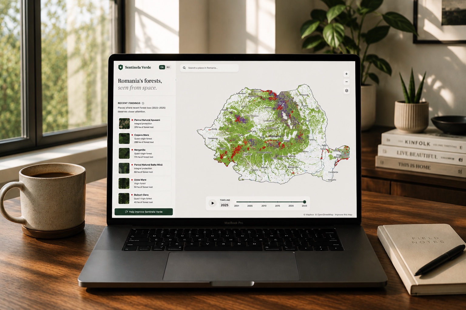 The Sentinela Verde app on a laptop, showing a map of Romania's forest loss